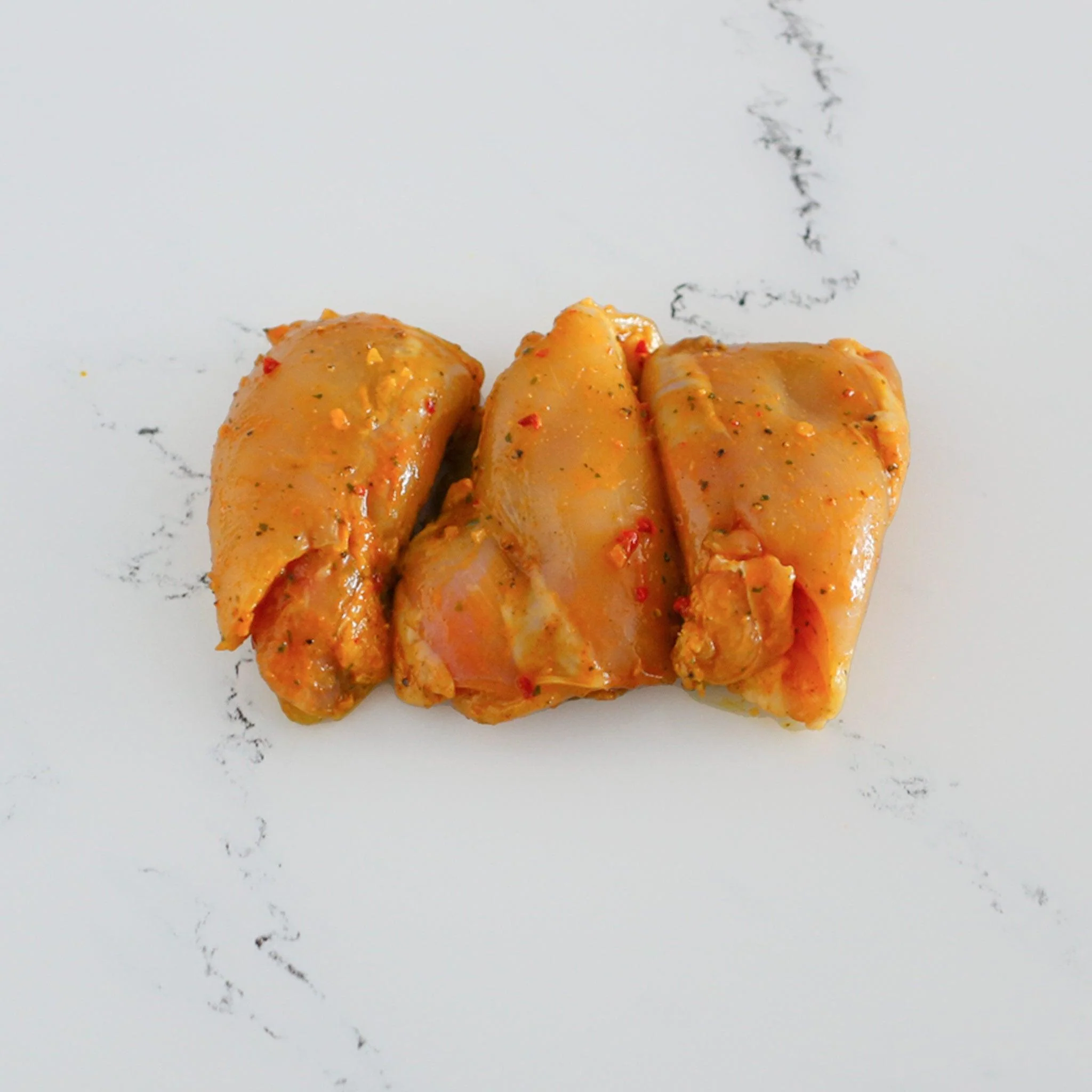 Hauts de cuisse de poulet marinés à l'Indienne